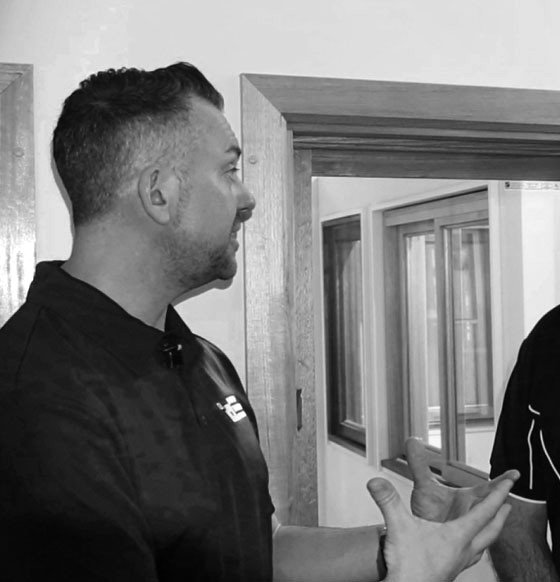 Travis meeting with a client on site